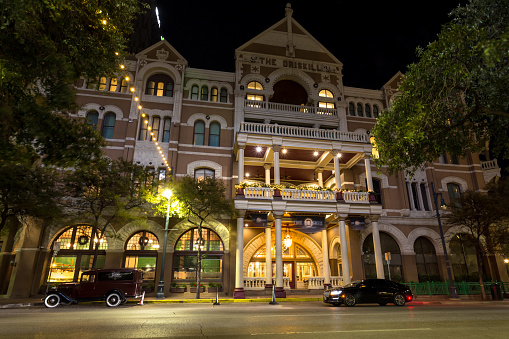 Austin, Texas, USA - November 25th, 2021: Famous historical Driskill hotel street view, illuminated at night