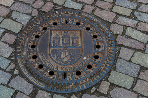 Prague, Czech Republic. 03.26.2014. Sewer hatch with the inscription in Czech \