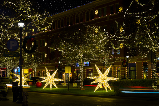 Frisco, Texas, USA - December 17th, 2021: Downtown street beautifully illuminated for Christmas