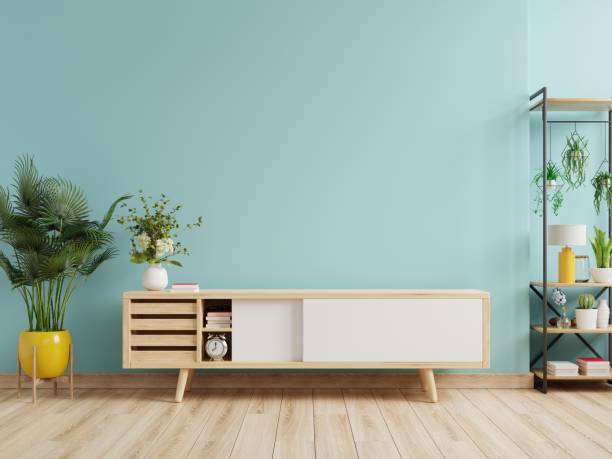 istock Living room interior with cabinet for tv on empty blue wall background. 1358672890