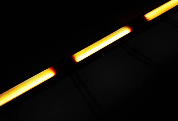 istock Diagonal yellow light lamps black backdrop 1358679316