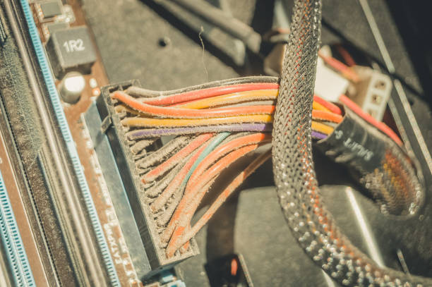 istock Dusty power wires inside the desktop system unit. A layer of dust and dirt on the insulation cables. Selective focus 1358680878