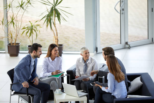 istock Business people cooperating and brainstorming at work 1358681712
