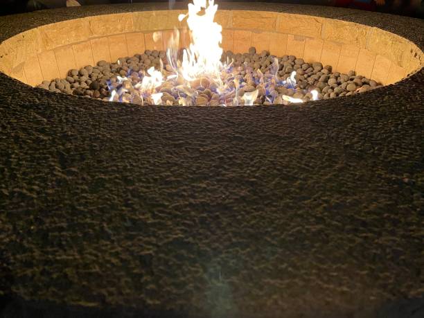 istock Fire in the stove at night 1358690811