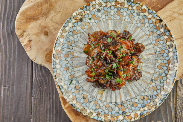 istock Jerusalem artichoke with shallots and herbs fried in pan 1358691014