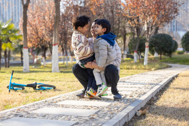 istock Father and son are playing in the park 1358691999