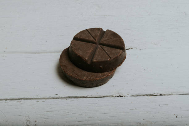 circular chocolate bars on wooden planks