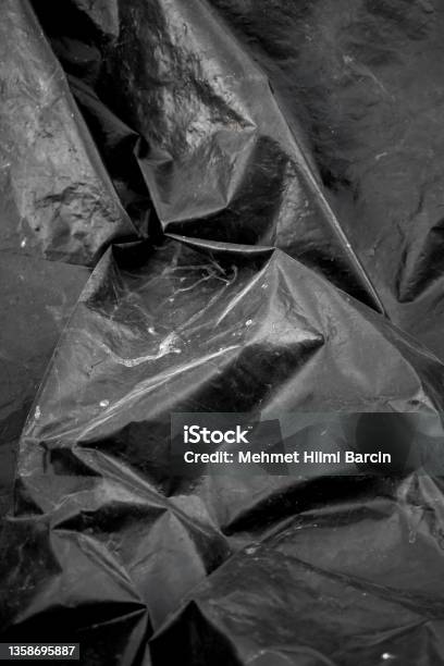 Crumpled Black Plastic Bag Texture Background Stock Photo - Download Image Now - Textured, Plastic, Black Color