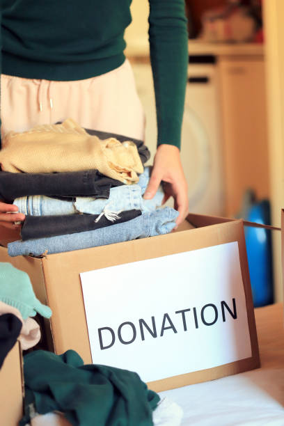istock Girl donating clothes 1358699456