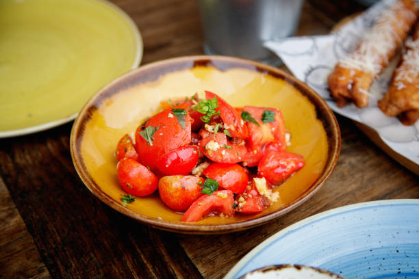 istock Cherry tomato with garlic, basil and parsley 1358699554