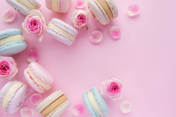 istock Tasty macaroons with beautiful roses 1358700653