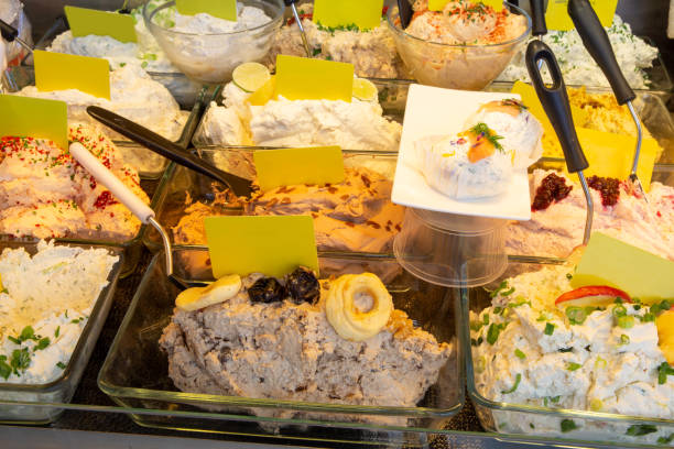 istock Cheese counter with different types of cream cheese 1358700972