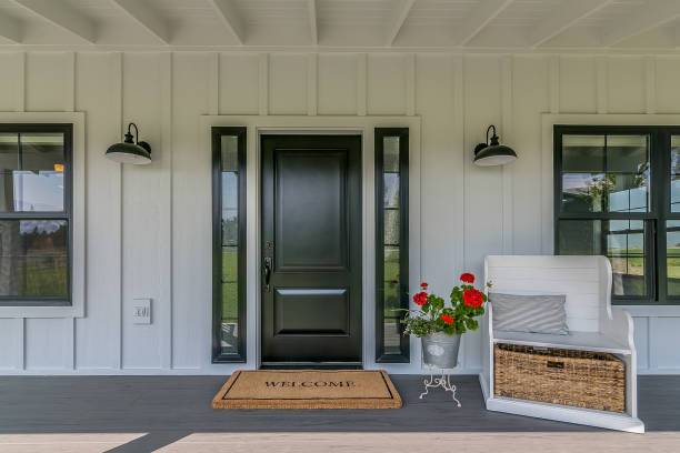 istock Large front porch with black door 1358701005