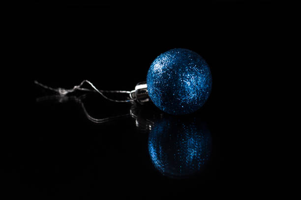 one blue christmas toy on a black background - vibrant color new traditional culture saturated color imagens e fotografias de stock