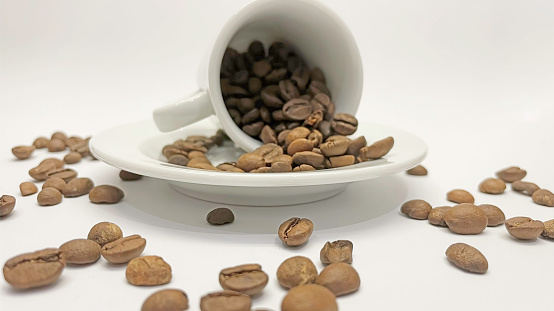 white coffee cup and roasted coffee beans