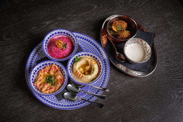istock Pureed Babaganus, Beet Labeneh and Hummus, served on restaurant table in bowls 1358704141
