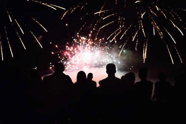 istock Crowd watching fireworks and celebrating new year eve 1358704251