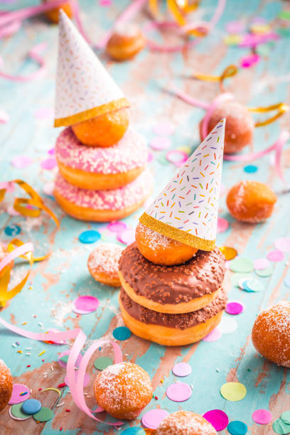 istock Krapfen, Berliner and donuts with streamers and confetti 1358705276