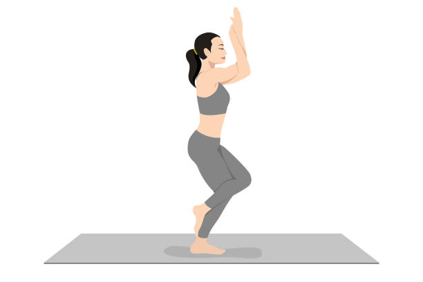 Eagle Pose, Garudasana Eagle Pose, Beautiful girl practice Garudasana, Young attractive woman practicing yoga exercise. working out, black wearing sportswear, grey pants and top, indoor full length, calmness and relax. garudasana illustrations stock illustrations