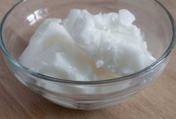Cosmetic product for skin and hair care: natural cold-pressed coconut oil and beeswax.