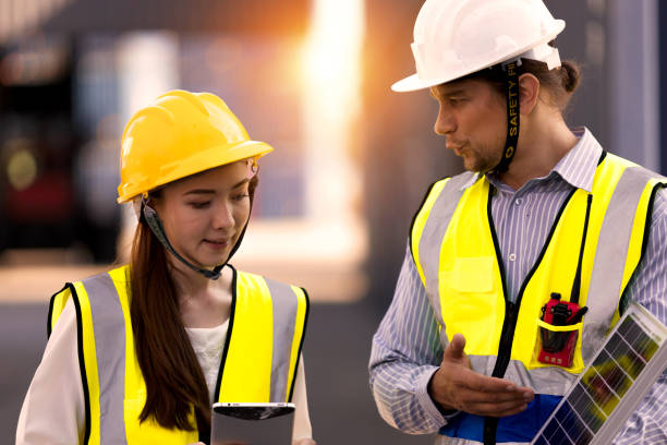 istock Caucasian male chief engineer is introducing solar panels to employees. 1358707856