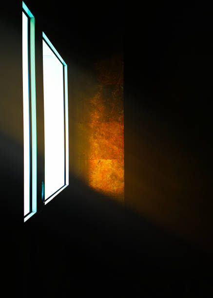 istock Ray of light illuminating closed door background 1358707922
