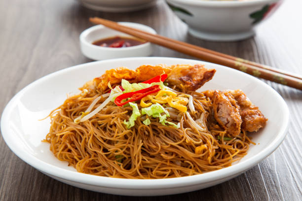Stir-fried Chinese economic rice noodles. Stir-fried Chinese economic rice noodles. Famous food of Malaysian breakfast Rice Noodles stock pictures, royalty-free photos & images