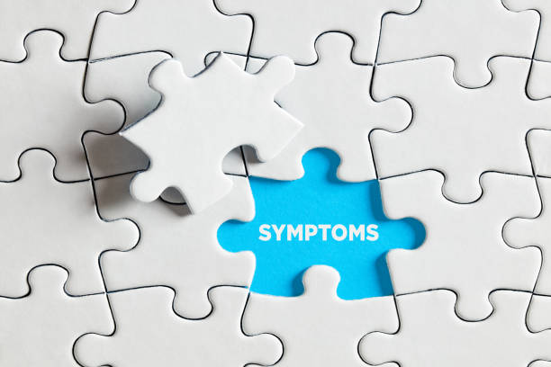 istock The word symptoms on blue missing puzzle piece. 1358712262
