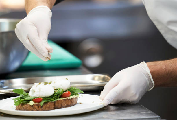istock Chef cooking food in restaurant kitchen, close-up 1358713894