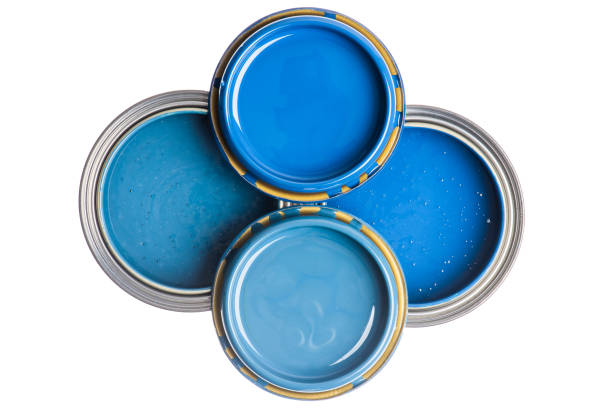 istock Opened cans with blue paint top view isolated on white 1358717096