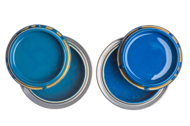 istock Opened cans with blue paint top view isolated on white 1358717864