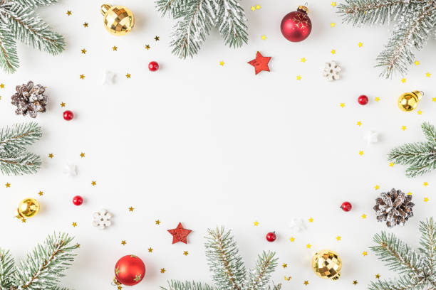 istock Christmas composition. Frame made of snow fir tree, gift boxes, festive decorations on white background. Flat lay 1358723081