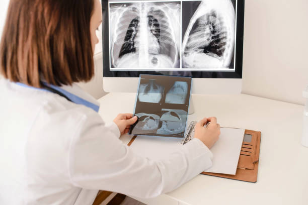 istock Young woman radiologist doctor analysis x-ray 1358723426