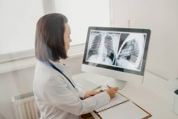 istock Young woman radiologist doctor analysis x-ray 1358723540