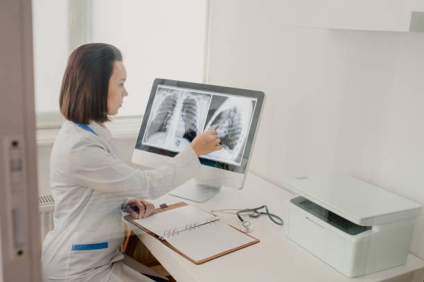 istock Young woman radiologist doctor analysis x-ray 1358724330