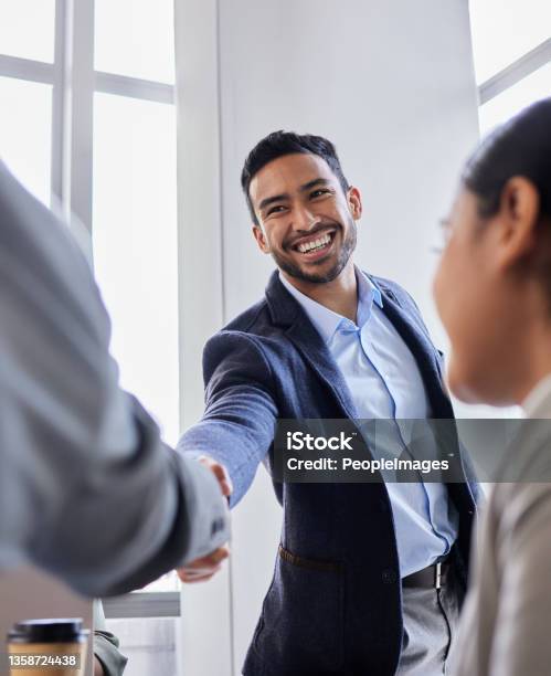 Shot Of Two Business People Shaking Hands During A Meeting Stock Photo - Download Image Now