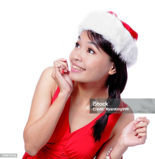 Joven Chica Mirando Hacia Arriba Navidad Foto de stock y más banco de imágenes de Adulto - Adulto, Adulto joven, Alegre