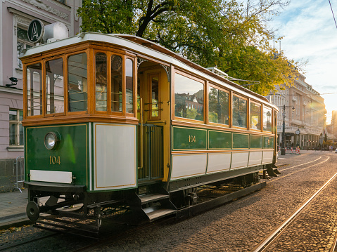 Shining restored historic tram in evening light