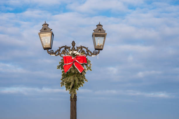 Lantern with Christmas decoration on a sunny winter day.