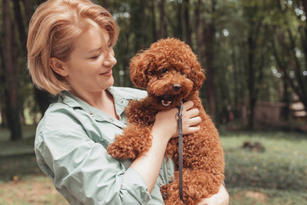 istock Woman With Dog 1358728715