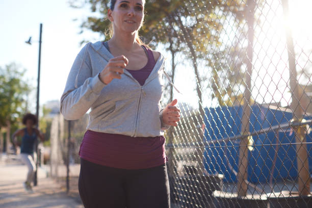 Close-up view of a woman jogging.