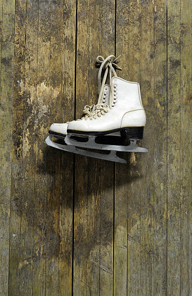 istock ice skates hanging on an old weathered wooden wall 135873071