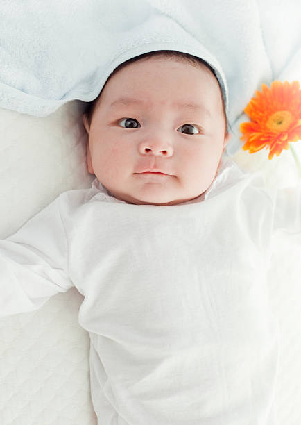 istock baby and flower 135873189