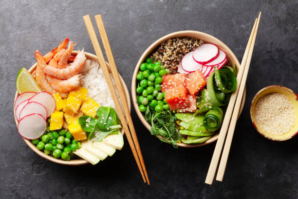 istock Poke bowls with shrimps, salmon, avocado and mango 1358734099