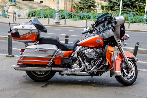 Bucharest, Romania - 6 May 2021: Harley Davidson classic motorcycle parked in a street in a sunny spring day