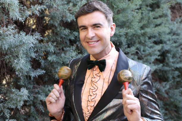 Glamorous gentleman playing the maracas Glamorous gentleman playing the maracas. spark singer stock pictures, royalty-free photos & images