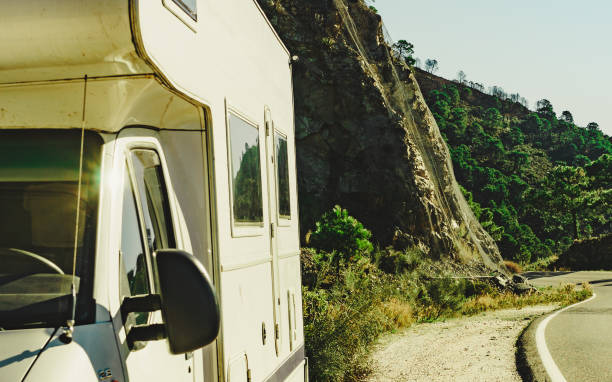 Caravan on roadside in mountains, Andalucia. Caravan on roadside. Road through spanish rocky mountains from Marbella to Ronda, Andalucia in Spain. stopover stock pictures, royalty-free photos & images