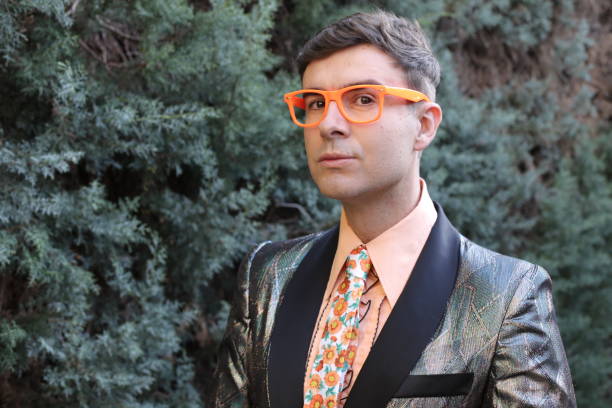 istock Funky man wearing sequins blazer and floral tie 1358739274