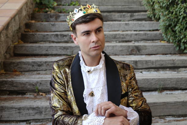 istock Fashionable king dressed in golden outfit 1358739320
