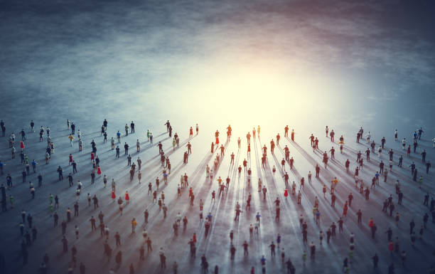 istock Crowd of diverse people walk to light. 1358740592